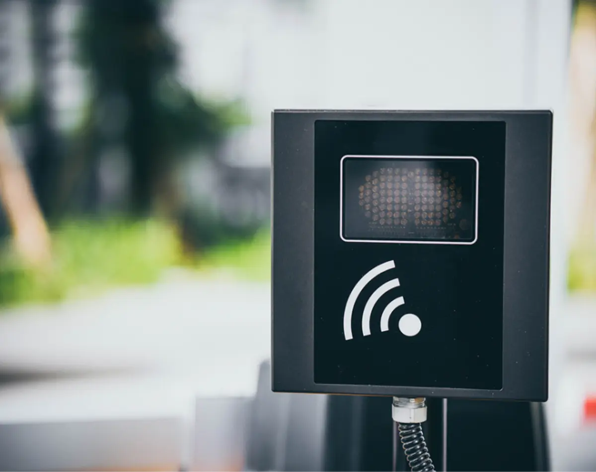 Close-up of an industrial RFID and wireless sensor scanning device mounted at an automated weighbridge gate